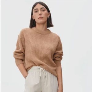 The oversized alpaca sweater, color is BURNT ORANGE